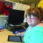 Producer Mindy Fila reviews a digital script